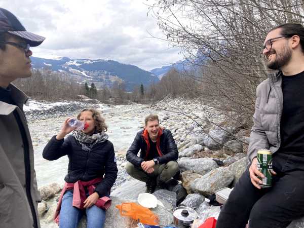 Group picture at a picnic by a river