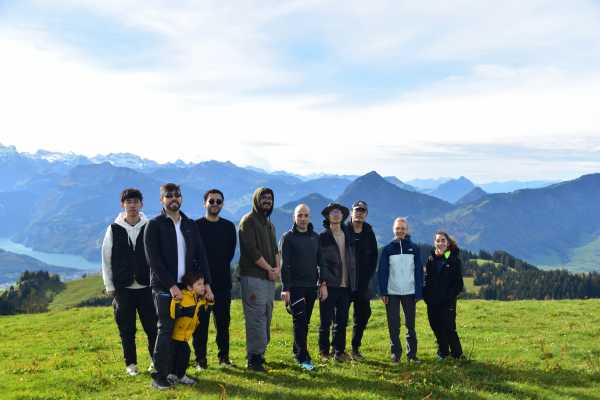 Group picture in front of mountain panorama